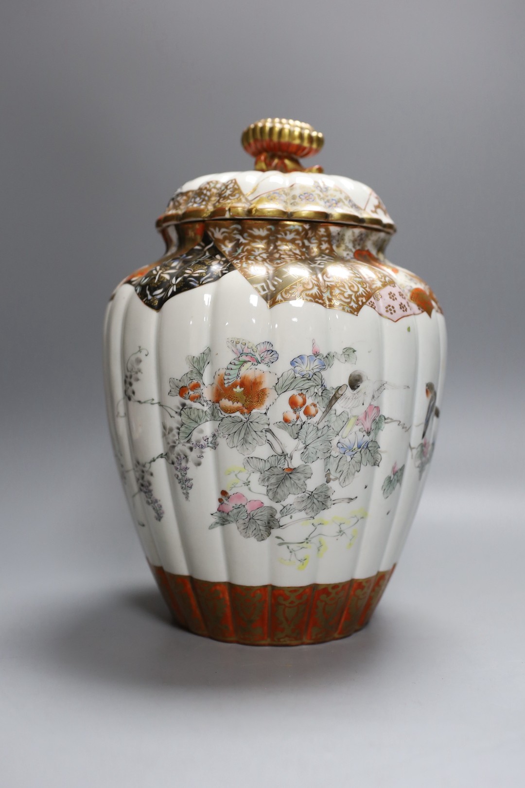 A Japanese kutani bottle vase, similar vase and cover (a.f), an Imari bowl and blue and white bowl. Largest 27cm